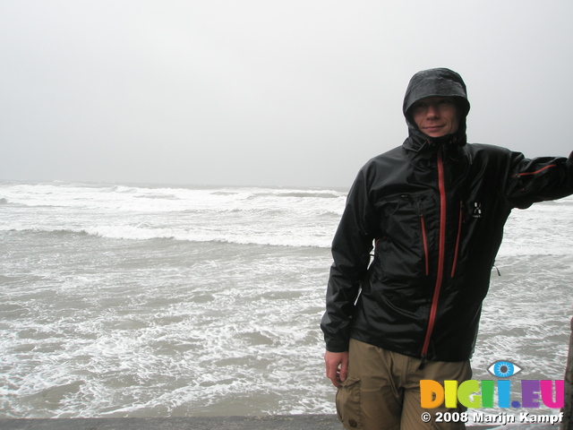 JT00838 Marijn in bad weather at Lifeguard house Tramore beach